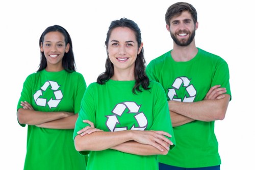 Team members placing a skip at a residential site